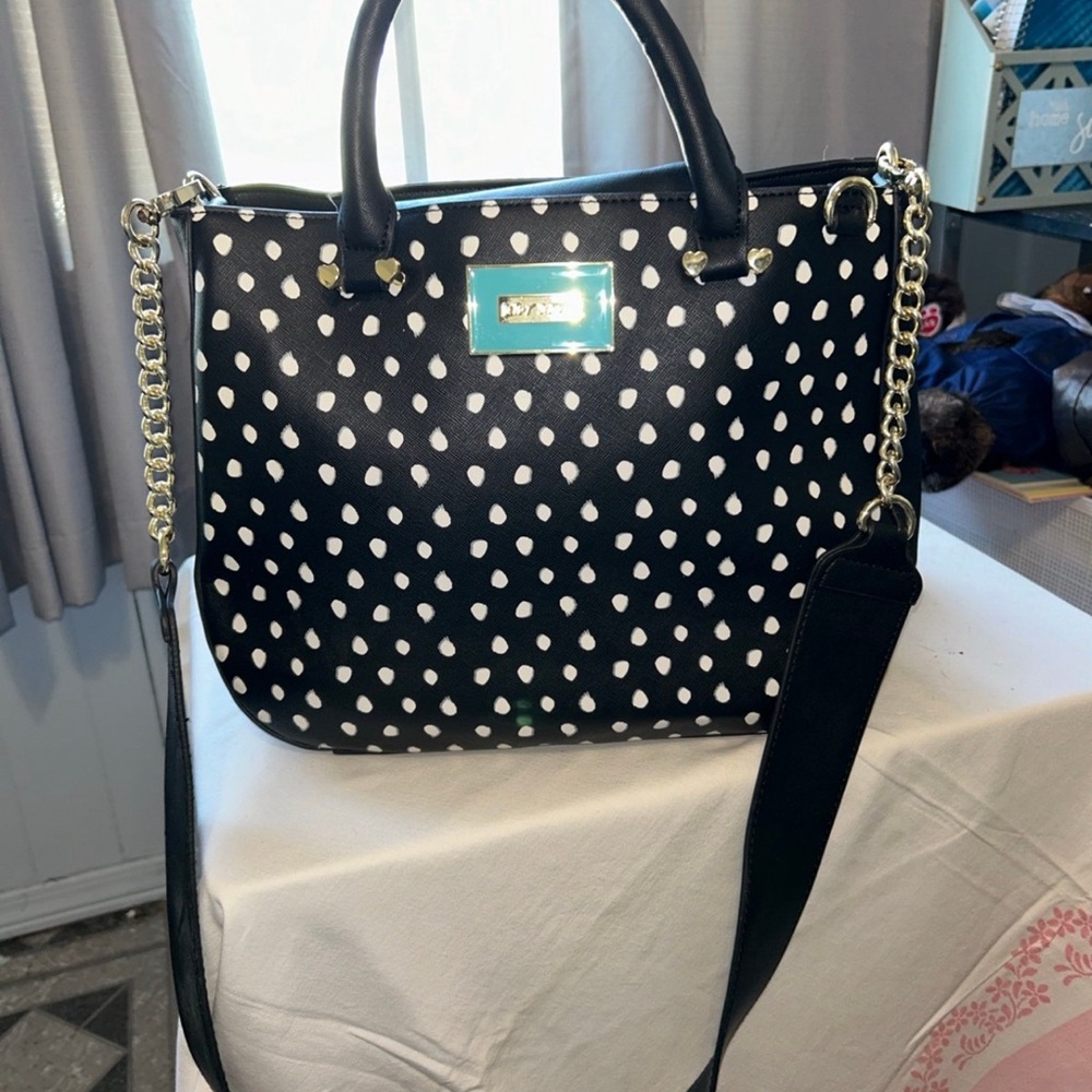 Betsey Johnson  Bag Black with white dots. Beautiful floral lining. nWT